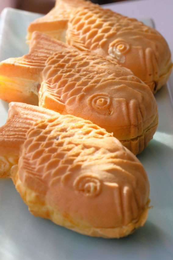 Close up of three pieces of taiyaki with sunlight shining on them